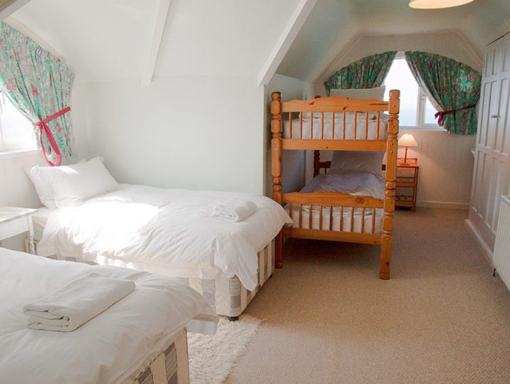 Bedroom with single beds and bunk beds Rinsey Head