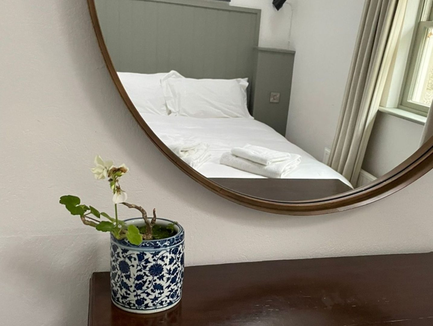 Porth Nanven Cottage mirror in double bedroom reflecting the double bed