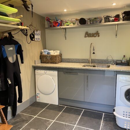 Internal Shot of Drying Room with Washing Machine, Tumble Drier and space for Wetsuits & Surf Boards