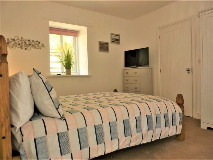 Coastal Retreat Double Bed in Master Bedroom with TV