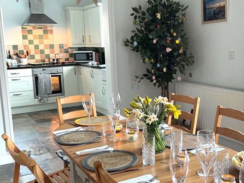Spend New Year in Spacious Barn, Table Laid for Celebration, Kitchen in distance