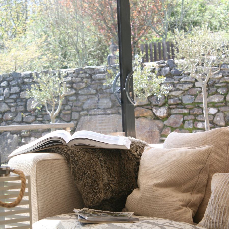 Comfortable Sofa in The Summer House, Mousehole with Books and Cosy Blanket