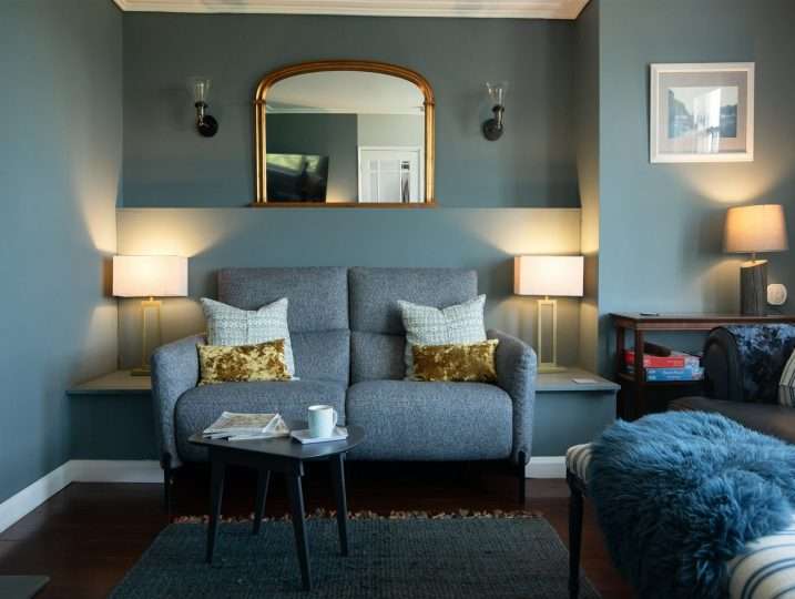 Sofa with two lamps & mirror | Retreat in Mousehole sea views