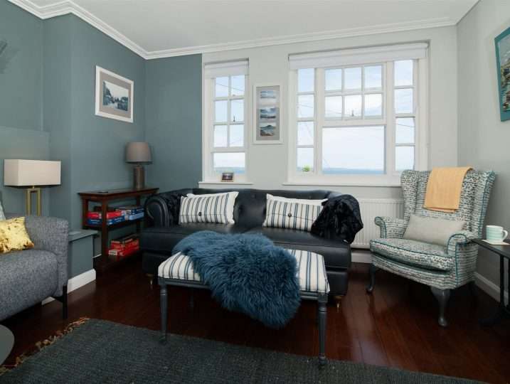 Sofa with sea view in background | Retreat in Mousehole sea views
