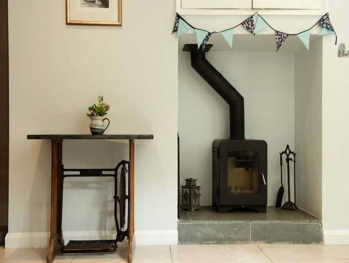 Woodburner in Dining Room | Retreat in Mousehole sea views