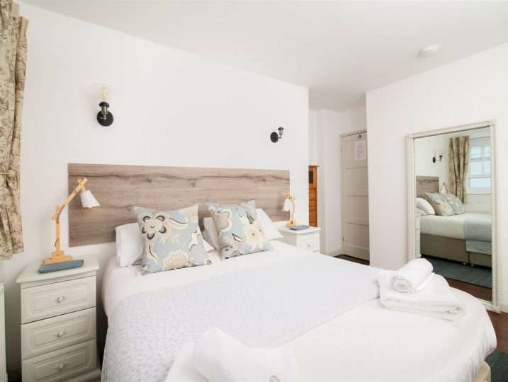 Spacious main bedroom with king size bed | Patio Garden | Retreat in Mousehole sea views